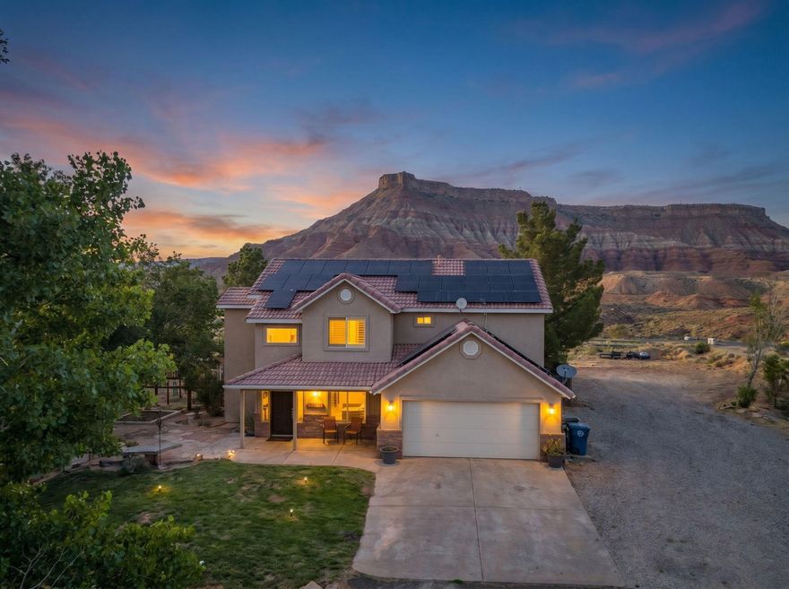 Perched on a private hilltop in the breathtaking landscape of Virgin, this one-of-a-kind property offers unmatched 360° panoramic views in every direction. From stunning red rock vistas to endless desert skies, every window captures scenery that feels straight out of a postcard. Conveniently located just 15 minutes from Zion National Park and only 30 minutes to St. George, this home perfectly blends privacy, adventure, and accessibility.
Situated on over an acre, the property features extensive owned solar, Luxury Vinyl Plank flooring throughout, mature fruit and nut trees, and plenty of space for toys, hobbies, and projects. The separate 1,000 sq ft garage/workshop is only 1 year old and includes an attached lean-to, offering endless possibilities for storage, recreation, or workspace needs. Additional features include an RV septic dump and exterior RV power for added convenience.
Whether you're looking for a full-time residence, vacation retreat, or investment opportunity, this hilltop escape delivers views, functionality, and serenity unlike anything else.