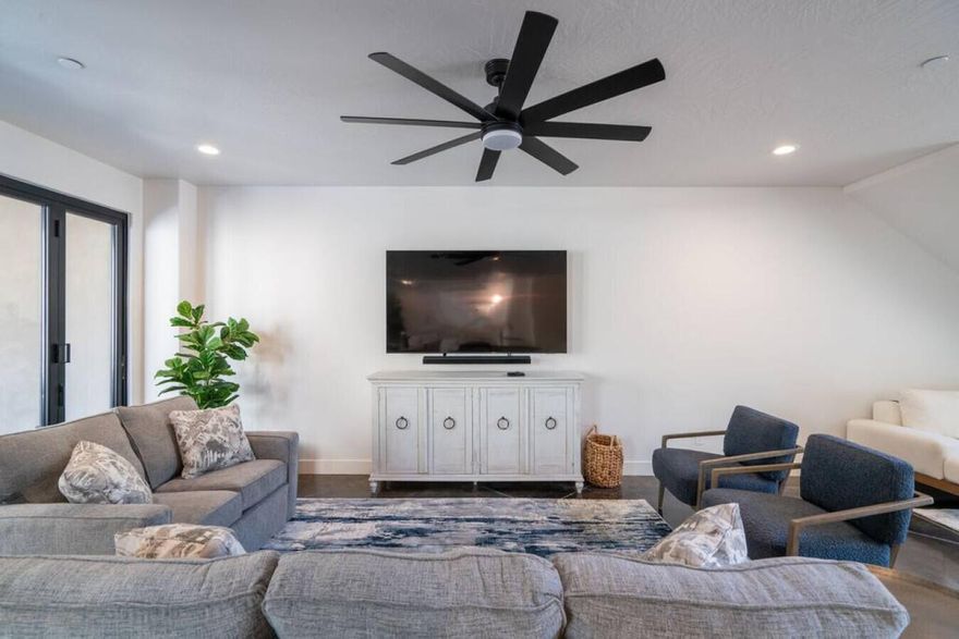 Enjoy outdoor living at its finest with a private hot tub and breathtaking views from two upper-level decks. Designed to comfortably accommodate family and guests, the home features three bedrooms plus a spacious bunk room/bonus room, offering sleeping space for up to 24. The open-concept floor plan flows seamlessly into the courtyard and covered patio, creating an effortless indoor-outdoor living experience. Equipped with a fire suppression system for added safety and peace of mind.