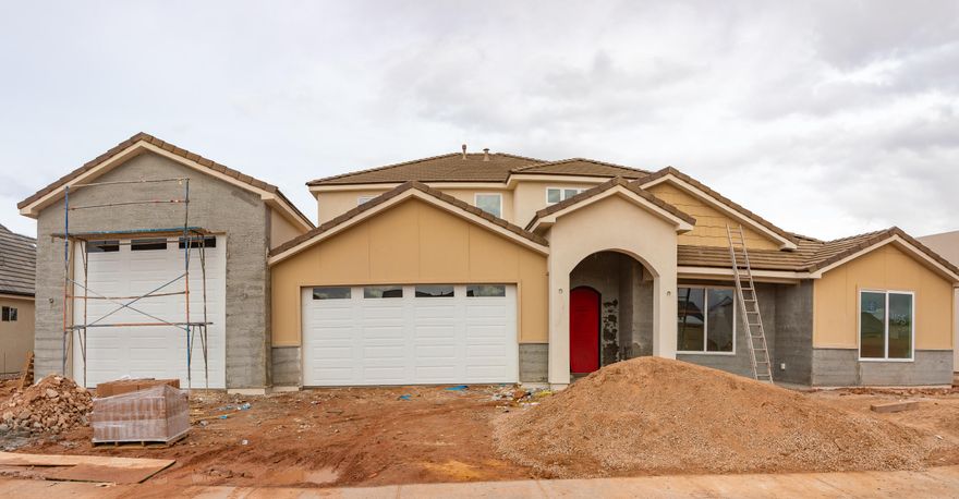 Beautiful new construction in Crimson Vistas - Phase 4, Lot 408! This thoughtfully designed two-story home offers a spacious open-concept layout with a large great room, well-appointed kitchen, and seamless indoor-outdoor living. The main level features a private primary suite, functional mudroom, and generous living space ideal for entertaining. Upstairs includes additional bedrooms and flexible bonus space perfect for a media room, office, or playroom. Enjoy multiple garage bays with ample storage and driveway access. Architectural rooflines, covered entry, and rear patio enhance curb appeal and outdoor enjoyment. Quality construction and smart design throughout make this a must-see opportunity in a desirable neighborhood.