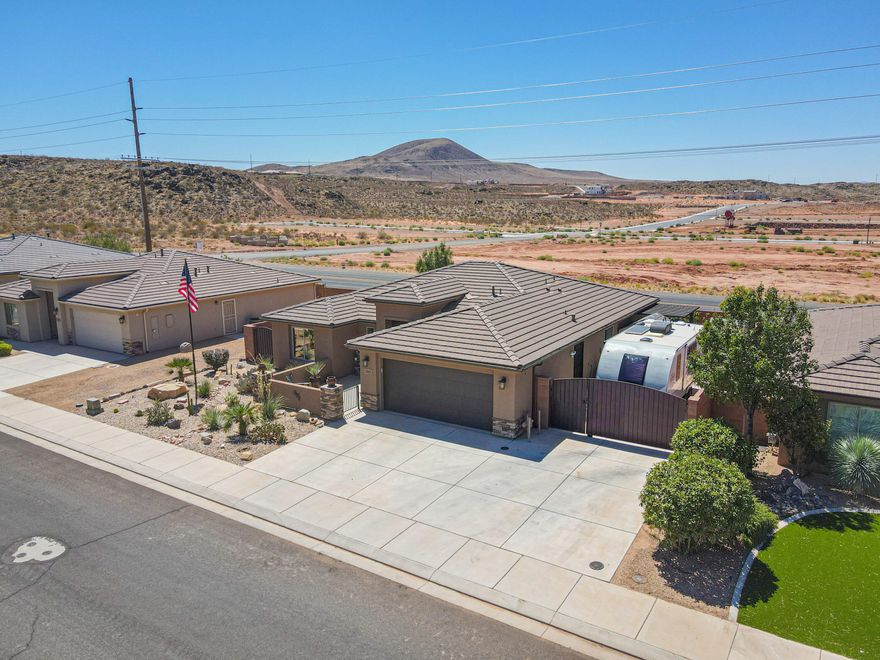 Stunning! Fabulous! Updated! Upgraded! $125,000 in professional remodel makes this home better than new. 2 Primary suites. One bedroom was transformed into an amazing office with Built-in Cabinetry, Built-in Desk, and a stunning barn door, leaving this actually a 2 bedroom plus office but It can be switched back to 3 bedrooms. Kitchen boasts 20ft glass door walk-in pantry, new cabinetry w/ roll-out drawers, Granite chiseled edge counter-tops, recessed lighting, subway tile. farm-tub sink, large island and much more! Grand primary suite with one-of-a-kind wood custom accents, two walk-in closets, bath includes: private loo, walk-in shower, built-in chest/cabinet.Family room has a ceiling-to-floor stacked stone wall w/ fireplace. See additional info in private remarks.