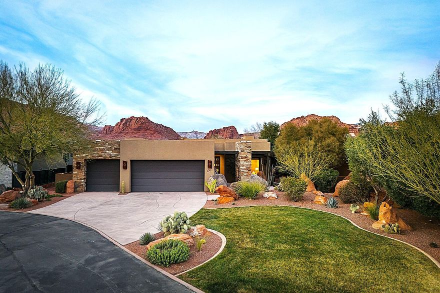Feel right at home in this Warm Contemporary Oasis, nestled perfectly in the heart of Snow Canyon.  This immaculate former Split Rock Model Home, located in the highly coveted and gated The Reserve at Entrada, has stunning views of Red Mountain, Padre Canyon, Snow Canyon, and the Red Cliffs Desert Reserve.  
Open your doors to the sound of several waterfalls, while warming by one of the 2 fireplaces inside and out.  Oversized 3 car Garage + bonus storage, Roof Top Patio, Thermador appliances, and much more.  Furniture available on a separate bill of sale.  
Associate Membership to Entrada Country Club required with purchase.  See agent for monthly fee details.  Visit https://www.golfentrada.com/ for Entrada Country Club Amenity info.