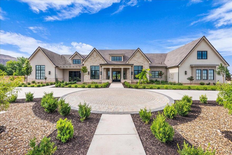 Discover a rare 5-acre estate, where modern luxury meets wide-open serenity. Completed in 2024, this thoughtfully designed home offers seamless accessibility with open living, a chef's kitchen with Wolf appliances, executive office, dual primary suites, casita option, gym, and designer finishes. Enjoy a sparkling 20x40 pool, oversized garage with dog bath, and future-ready EV and solar prep. With water shares included and a fully serviced barn pad ready for horses, agriculture, or a custom build, this property is both a private retreat and a canvas for your dreams, just minutes from Southern Utah's best amenities and natural wonders.