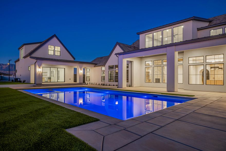 Located in the new luxury subdivision ''The Grove'' with stunning Pine Valley Mountain views, this luxury estate showcases a private pickleball court, 20x40 pool and hot tub, and a detached 1,500 sqft casita with 3 bedrooms and 2 bathrooms. The home spans over 8,000 sqft with 9 bedrooms and 10 bathrooms, featuring a chef's kitchen with Wolf and Sub-Zero appliances, a spa-inspired primary suite with heated floors and steam shower, exposed wood beams, designer finishes, private office, mirrored home gym, and an oversized boat garage. Set on a rare ¾-acre lot, this property offers tons of space, recreation, and a one-of-a-kind lifestyle in one of Southern Utah's most desirable locations.