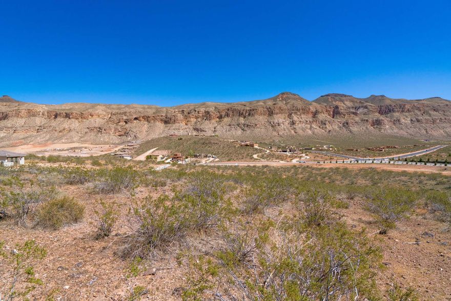 A rare land opportunity in one of Southern Utah's fastest-growing lifestyle destinations. This offering includes approximately 15 acres comprised of multiple tax IDs, ideally located just minutes from Zion National Park and Sand Hollow State Park, and adjacent to the award-winning Copper Rock Golf Course. With exceptional scenery, strong accessibility, and development potential, the property is well suited for a luxury residential community, large-acre estate lots, or a signature development project. With this being fully entitled, the acreage provides a flexible canvas for a variety of architectural styles and layoutswhile still allowing buyers to bring their own vision and design team. Expansive natural surroundings, panoramic mountain and cliff views, and quick access to outdoor recreation make this a high-demand location for today's buyers seeking space, privacy, and connection to nature. Making this an appealing choice for both local and out-of-state buyers looking for a scenic yet accessible retreat. The region's rising market interest, strong tourism economy, and premium view corridors create a compelling long-term investment with excellent resale potential. Opportunities like thissize, views, adjacency to golf, and recreation accessrarely become available. Secure your foothold in one of Southern Utah's most desirable growth areas and bring your development vision to life.