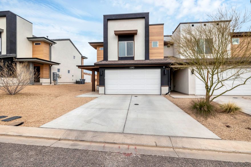 Enjoy privacy and beautiful views in this desirable end-unit townhome with no backyard neighbors!  The open concept main floor features durable laminate flooring throughout, creating an inviting space for everyday living.  The kitchen is equipped with  stainless steel appliances and flows effortlessly into the dining and living room areas.

Just a short walk away you can take advantage of an incredible array of community amenities, including a resort style pool and hot tub, pickleball courts, splash pad, dog park, and an 18 hole putting course, plus so much more!  This townhome blends comfort and style in a vibrant community!