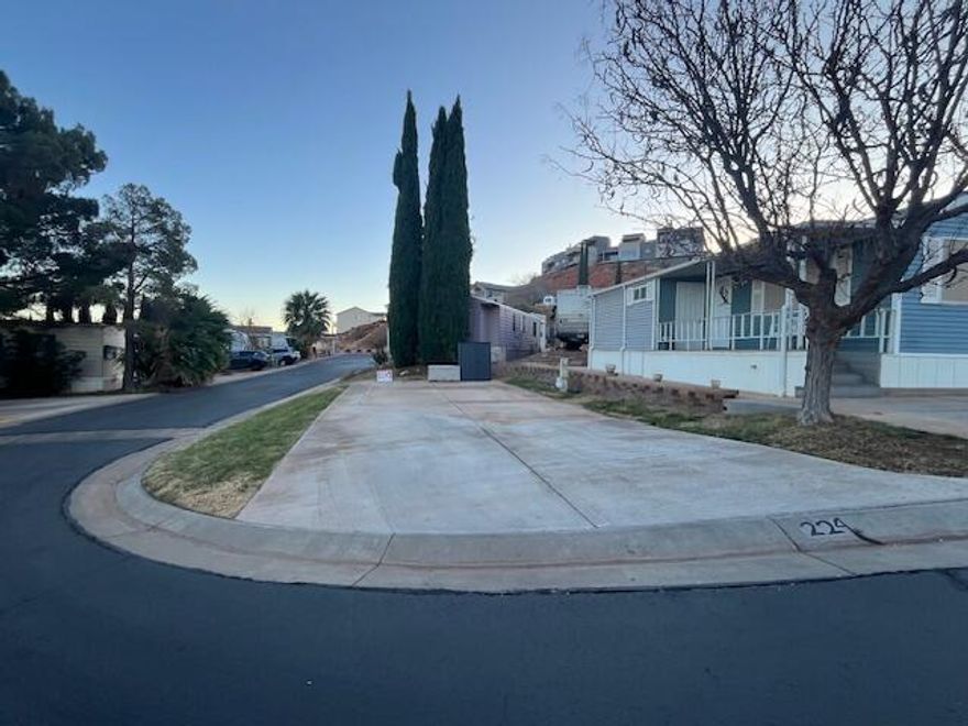 Corner lot ready for your RV, tiny home or Park model. Twin Lakes is a beautiful & peaceful 55+ community located off Red Hills Pkwy. and nestled into the red rocks. It's very quaint and peaceful, yet located close to shopping, hospitals, walking trails and so many other amenities. 
Buyer to verify all information and make sure whatever you are placing on this lot fits the requirements, set backs and size.