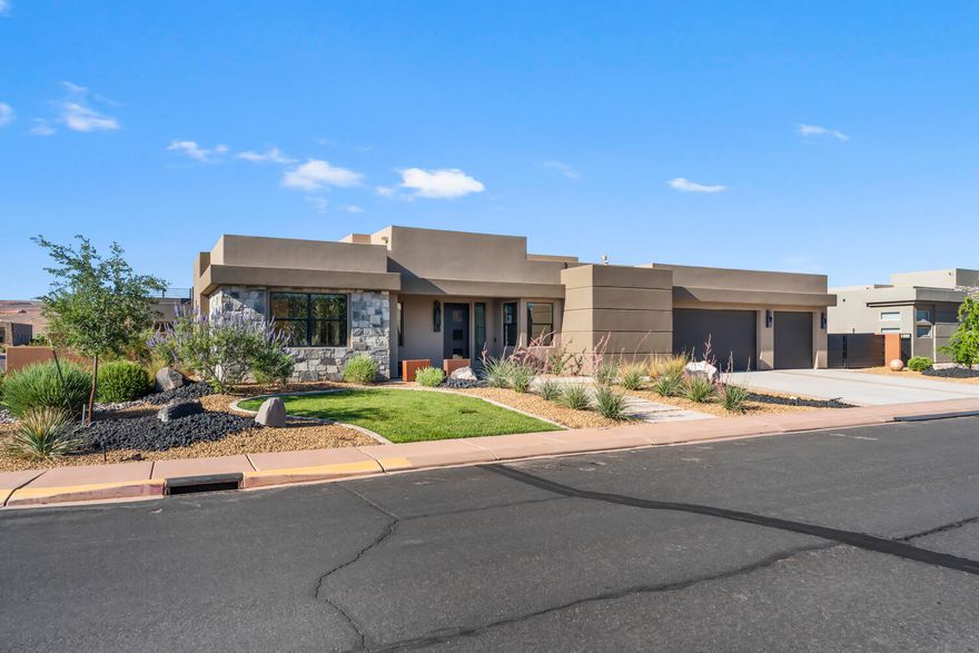 Located in the highly sought-after Dunes at Sand Hollow Resort, this beautifully designed 4-bed, 3.5-bath home offers the ultimate in resort-style living. Spend your days boating, golfing, hiking, or off-roading, all just minutes from your front door. Inside, the large open kitchen flows seamlessly into a spacious family room, perfect for relaxing or entertaining. The home features elegant accent lighting throughout, a modern electric fireplace, and high-end finishes in every detail. The primary suite features a spa-like double shower and freestanding tub, with en-suite baths in every additional bedroom. The fully enclosed backyard is professionally landscaped, low-maintenance, and includes a gas BBQ stub, ideal for enjoying Southern Utah's year-round sunshine. Community amenities include 3 heated pools, a hot tub, pickleball courts, a fitness center, and a clubhouse with a restaurant and ProShopjust a short walk away. With a 3-car garage for all your toys, this home is ready for adventure. Don't miss your chance to start living the Southern Utah dream!