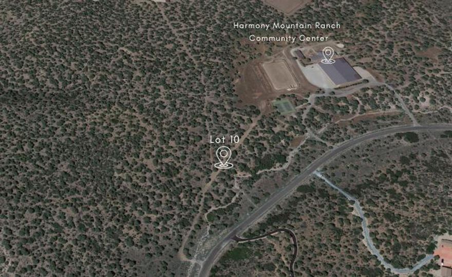 Amazing 19.56 acre lot with 360 degree views. Are you a horse enthusiast? This lot is for you! Board your horse at the community center and ride your side by side one lot over! Harmony Mountain Ranch boasts a state-of-the-art Equestrian Facility including a 150&#8242; X 225&#8242; covered arena with an air conditioned & heated viewing lounge of the arena. The equestrian center also includes an outdoor 160&#8242; X 250&#8242; arena with roping facilities, 20 stalls, 4 wash racks, 2 grooming stalls, 45&#8242; Rocking W round pen, full-time, on-site barn/property manager, and optional horse boarding.