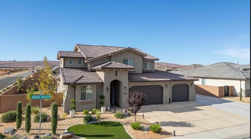 Spacious 5 bed, 5 bath home with oversized 4 car garage and a bonus concrete RV parking pad. Situated on a corner lot in a desirable, growing neighborhood. Every bedroom features its own private bath plus it has an upstairs bonus family room for extra living space. Fully landscaped yard with concrete walkway, pavers, artificial grass,  plants and trees for a sleek clean look. Just minutes from Sand Hollow Reservoir,  spectacular sand dunes, 2 extra fun water parks, and a new rope climbing park.- perfect for those looking to be close to outdoor adventures.