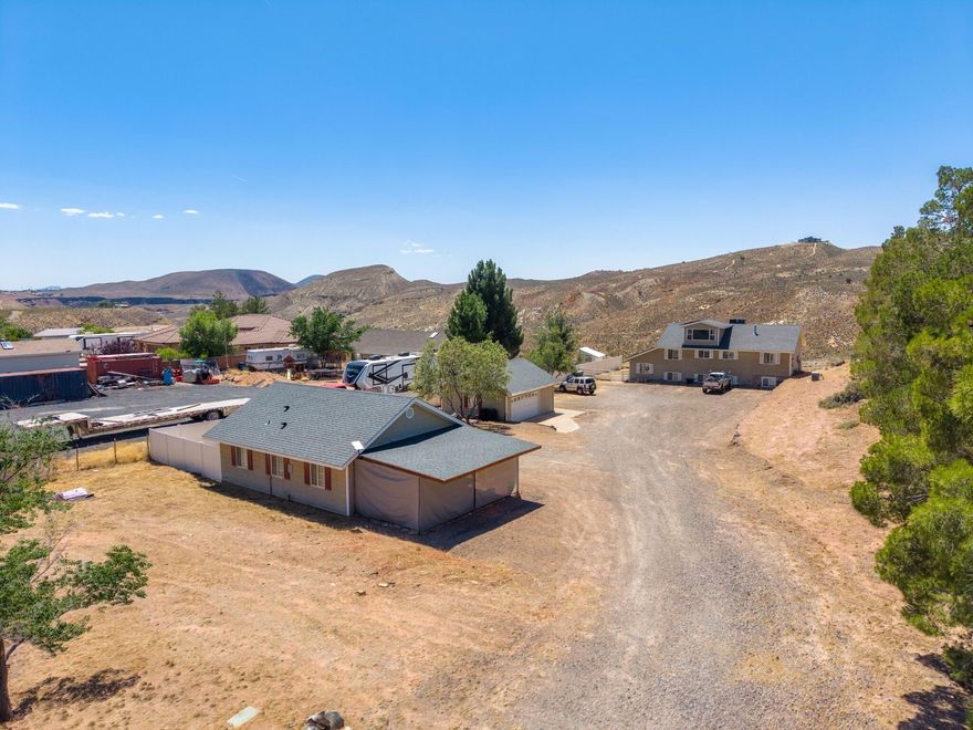 Perched on a sprawling .7-acre lot in La Verkin with absolutely unreal panoramic views, this one checks boxes most properties can't even touch. Featuring 6 bedrooms, 5 bathrooms, and a separate 700+ sq ft ADU setup with distinct upstairs and downstairs living, this property is built for flexibility, income, and long-term value.
Whether you're looking for the ultimate multigenerational setup, rental income potential, or what can only be described as a house hacker's dream scenario, this home delivers. Multiple living spaces create endless options for owner-occupancy, long-term rental, guest quarters, or private accommodations for extended family, including a full 50A RV service.
The property also features solar for energy efficiency and a fully functioning natural gas backup generator--giving peace of mind and serious utility savings. Add in the oversized lot, room to breathe, and sweeping Southern Utah views in every direction, and you've got a rare opportunity that blends lifestyle, practicality, and investment potential all in one property.
