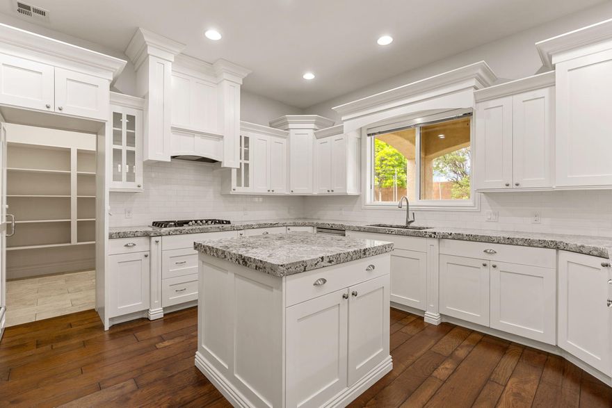 Don't miss this stunning property! Modern finishes with large open kitchen, white custom cabinetry in kitchen, accented by a darker rich wood contrast throughout. Hardwood flooring on the main, Massive hidden pantry, granite countertops, designer tile, stainless appliances. The Perfect home for entertaining! Home also has a large front room on the main floor that can be used as a formal living room or large office. Upstairs has a 2nd family room with plenty of space. Also two large storage closets up. Private backyard features a beautiful in-ground pool.  The smaller pool allows you to keep it heated inexpensively for year round use.  Home has a covered patio and space to make your own backyard sanctuary - plus NO HOA or transfer fees! Home is vacant, immaculate and super easy to show!