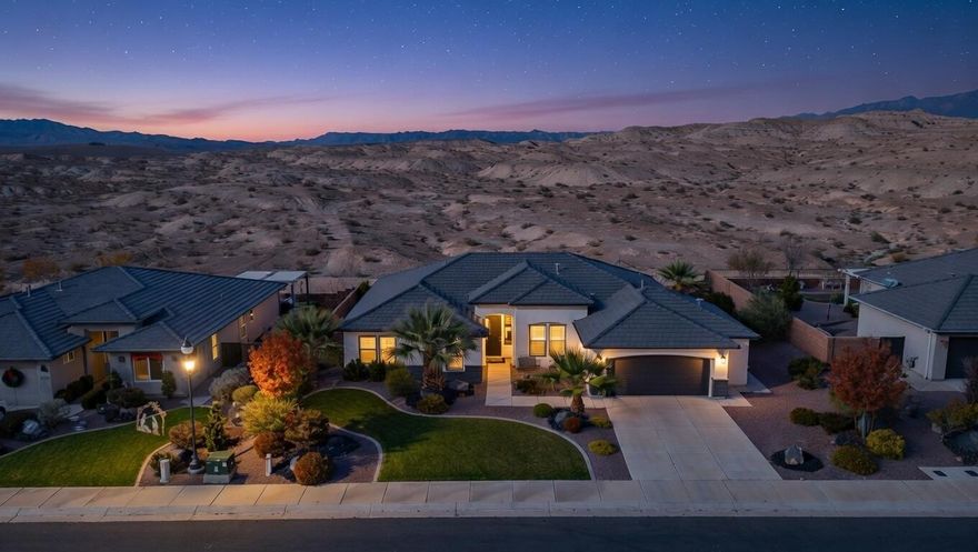 Enjoy a private backyard with no rear neighbors, as this home backs directly to the White Dome Preserve, offering protected land and lasting open space behind you.This stunning home offers spectacular views of Pine Mountain and the surrounding hills, along with unforgettable Southern Utah sunsets. It shows better than a model and feels virtually brand new.

Thoughtfully upgraded throughout, the home features custom window coverings, a climate controlled garage with a mini split system, and a striking fireplace with built in cabinetry that anchors the living space with warmth and style. The expansive kitchen is designed for both entertaining and everyday living, offering generous space, high end finishes, and seamless flow into the main living areas.

Garage layout image includes AI assisted visualization to demonstrate potential three car configuration based on recorded dimensions. Actual fit and functionality will vary depending on vehicle size. Buyers to verify suitability to their satisfaction. Elite living meets rare privacy on this premium view lot, backing directly to the dedicated White Dome Preserve, ensuring no future construction behind the home. Enjoy peaceful open space and a natural desert backdrop with sweeping views and wide open skies.

This is a truly special property where luxury, tranquility, and scenery come together in one of St George's most desirable settings.

Garage layout image includes AI assisted visualization to demonstrate potential three car configuration based on recorded dimensions. Actual fit and functionality will vary depending on vehicle size. Buyers to verify suitability to their satisfaction.