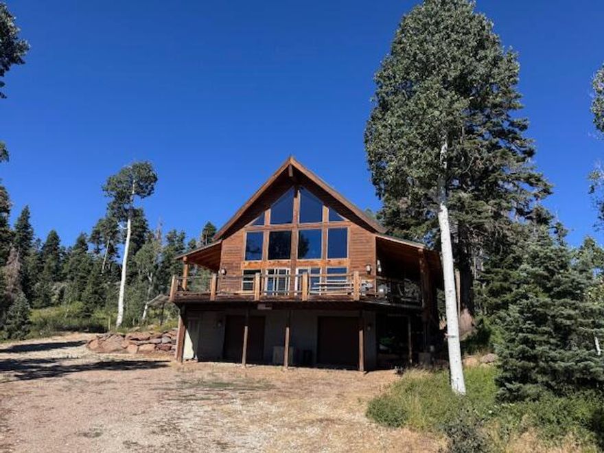 Welcome to 345 Terrace Drive! Off-grid living at its finest! Solar and generator powered with a community water system. Huge 2,000 gallon water storage. Push a button and the entire cabin comes alive with all creature comfort amenities. Deck was recently replaced/updated. Walk around this property and the value is quickly apparent. Expansive views off of the wrap around deck with two covered sides. Kolob reservoir and endless atv/hiking trails gives you the perfect retreat.  This property is selling with most of the furnishings included.