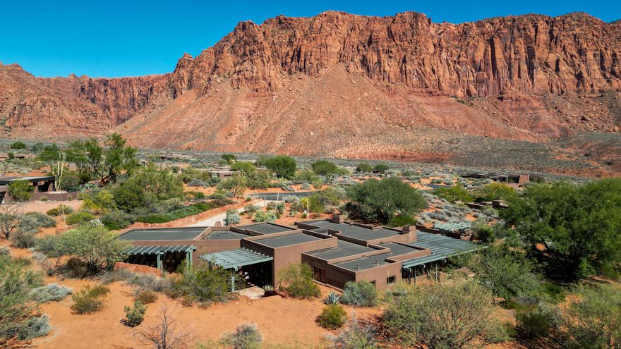 Gorgeous Kayenta home located on a prime 1.33 acre Estate lot with stunning panoramic red rock views featuring superb privacy at the end of a cul-de-sac, surrounded by mature desert landscaping. The home underwent a substantial remodel to the studs in 2017 and new exterior paint in 2022. Fresh interior painting completed in 2023. Open floor plan features smoked French Oak flooring throughout complimented by exposed pine ceiling beams. Open Kitchen offers beautiful quartzite countertops, top of the line stainless gas stove, double ovens with warming drawer, double sink, prep sink along with back lit and undercabinet lighting. You will enjoy the spectacular red rock and desert scenery through the oversized windows while seated both at the bar in the kitchen & the adjacent large dining area. The large Primary bedroom offers continuous panoramic views. Bathroom includes a double vanity, custom shower and walk-in closet with built-in cabinets. Two additional en-suite bedrooms, one with murphy bed which can conveniently flex as an office, offer additional private living space. The oversized family area has a beautiful built-in blue pine entertainment center and opens through double glass sliding doors to a private courtyard. A second sitting area is surrounded with oversized windows featuring idyllic views and includes a cozy gas fireplace. Private patios on both front and rear of residence total 3500 sq/ft. The covered front patio includes a built in small pool/spa, gas fire pit and built-in grill with cooktop. The oversized two car garage has epoxy floors, mini split HVAC, built in custom cabinets with sink and extensive finished countertop space.