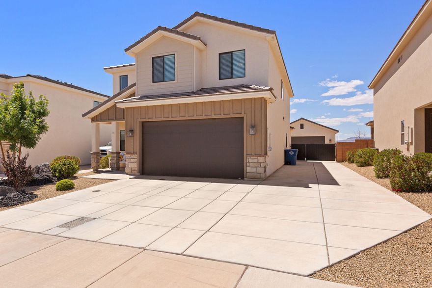 Newer home located in the new White Trails Subdivision in South St. George.  Surrounding area is developing quickly!  Home is located near new Costco, grocery stores and other retail establishments.  Home comes with granite counters, LVP flooring, white cabinets and stainless steel appliances.  Open kitchen and living area located on the main level.  Home comes with a low maintenance yard with room for relaxing and entertaining.  RV parking is available on this home as well as a separate detached 2 car garage.