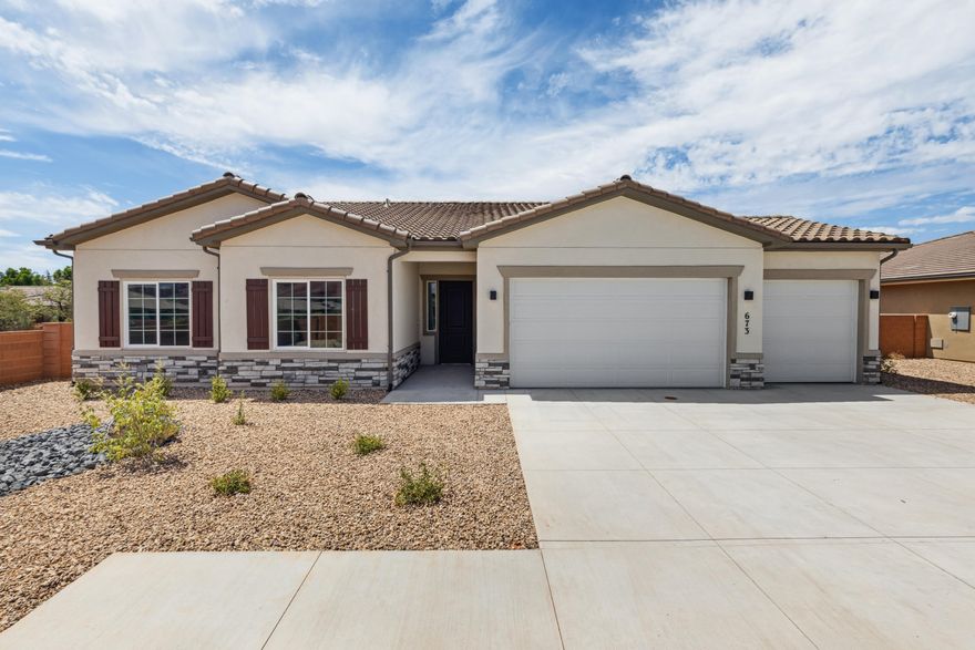 Interest rates as low as 3.999% available through our preferred lender. Surrounded by beautiful desert and mountain scenery. Fire Lake at Ivins Reservoir, Unity Park, and Kayenta Art Village are very close by. a short drive will get you to Tuacahn Ampitheater, Snow Canyon state park and Black Desert Golf Course and resort. This open and bright floorplan has a sunroom extension off the large kitchen. Enjoy quartz countertops throughout, a fireplace in the great room and a gourmet kitchen. It also has a shady covered patio off the back of the home.