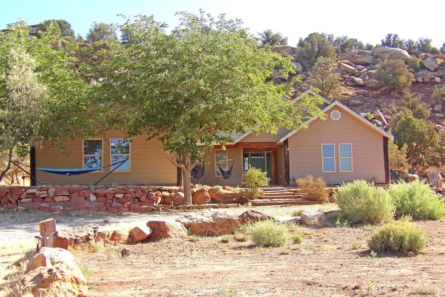 Framed by the majestic Zion National Park, Mount Smithsonian, Canaan Mountain, and Little Creek Mesa. This hidden gem blends rustic charm with natural beauty. 4-Bedroom 2 bath in Apple Valley, UT on a sprawling 1.03-acre lot, this property offers ample room for horses or other animals, complete with breathtaking views of Zion National Park and surrounding mesas. The home shines with fresh upgrades, including new flooring, paint, faucets, appliances, and baseboards. Additional highlights include outbuildings perfect for a shop or tool storage, plus a delightful tree house for endless family fun. Embrace the peaceful, rural lifestyle with modern conveniences in this Apple Valley gem—schedule your showing today!