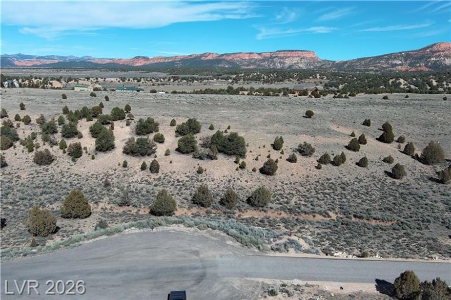 Tucked high on the majestic Paunsaugunt Plateau, this 2.18-acre homesite in Paunsaugunt Cliffs offers the perfect blend of mountain serenity & modern convenience. Set at approximately 7,000 ft elevation just off scenic Byway 89 near breathtaking Bryce Canyon National Park, the property features open mountain terrain sprinkled with native trees, crisp alpine air & expansive southern Utah skies. This horse-friendly, cabin-style community features paved roads & year-round access ideal for a full-time residence, mountain retreat, or vacation rental. Year-round public water is stubbed to each lot, with underground power in place. A septic system will be needed when you build. Protective covenants help preserve the natural beauty & peaceful character of the neighborhood, where your closest neighbors may be deer, wild turkey & other wildlife. Build your dream escape in one of southern Utah's most scenic high-country settings.