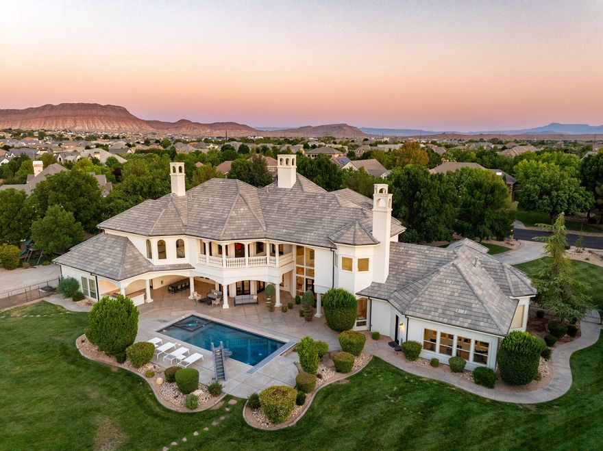 Extremely rare 1.82-acre lot in Washington Fields with stunning Pine Mountain Valley views. Extensive remodel by a local high-end builder brings timeless elegance and modern luxury throughout. Step inside to soaring ceilings, walls of glass, and a dramatic curved staircase. The main home features a grand primary suite plus four private bedroom suites, with a separate casita for guests.
Highlights include an RV garage, advanced home automation, a state-of-the-art theater, rich hardwood floors, and four new HVAC systems. Outdoors, enjoy a sparkling pool with new slide and heater, built-in BBQ, lush lawns, mature trees, playground, and basketball hoop. Set on a peaceful cul-de-sac with no HOA, this estate blends rare land, breathtaking views, and refined design.