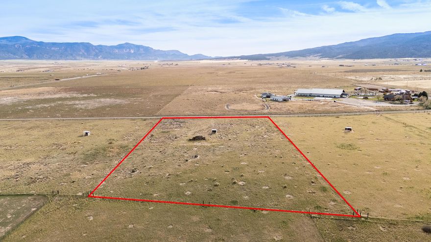 Discover open space and opportunity with this 5.09-acre parcel located near Lake Quichapa in Cedar City, Utah. Offering excellent access and recent area improvements—including chip-sealed main roads and a paved road ending at 7700 W—this property combines convenience with wide-open rural charm. The land is fully fenced and comes equipped with livestock waters and weather sheds, making it ideal for ranching, recreation, or future development. Enjoy sweeping views of the Kolob Mountains, creating a beautiful backdrop for your Southern Utah retreat or small ranch. This parcel is offered individually or the adjoining lot can be purchased, giving buyers the option to expand their acreage and possibilities. Adjoining property is 7886 W 2000 S. Power is not currently stubbed to the property but is located nearby (approximately at 8100 W or 7700 W). No water rights or shares are included, but there is a joint well agreement in place for well that is on neighboring lot. Buyer to verify all information. Whether you're looking for a peaceful getaway, livestock property, or long-term investment, this acreage delivers space, access, and views - all just a short drive from Cedar City.