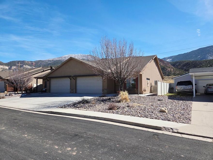 Step into this spacious 2 bed 2 bath single-level twin home in Cedar City. The property borders the City's scenic walking trail and nearby BLM land. This well-appointed home features a roomy kitchen designed as the heart of the home, upgraded cabinets and finishes, shutters, and soaring 9-10 ft ceilings with ceiling fans throughout. The primary suite offers a custom shower and private backyard access with trail and mountain views. Enjoy a low-maintenance yard and 419 sq ft two-car garage with over-sized laundry/mud room. The back yard has a great outdoor BBQ and awning for shade. Located in beautiful Cedar City which is home to Southern Utah University, the renowned Utah Shakespeare Festival, and year-round access to Dixie National Forest for recreation.
