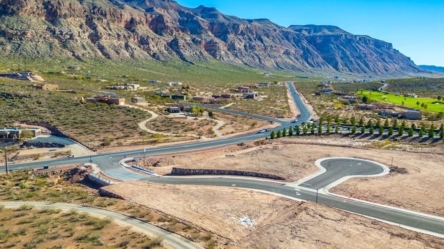 Discover The Views at Hurricane Cliffs, where modern living meets the iconic landscapes of Southern Utah. These premium oversized homesites offer sweeping views of red rock cliffs, desert mesas, and expansive skies. Nestled in a quiet, elevated setting with direct access to world-class hiking, biking, golfing, and off-roading, the community also enjoys convenient proximity to shopping, dining, and everyday amenities. Each lot is thoughtfully positioned to maximize privacy, views, and natural light, providing an ideal canvas for a custom dream home. Buyers may collaborate with an exclusive group of approved builders recognized for exceptional craftsmanship and custom design. These experienced builders are dedicated to creating homes that blend effortlessly with the landscape while capturing your personal style and vision. The Views at Hurricane Cliffs offers a rare chance to build in one of Southern Utah's most breathtaking and fast-growing areas. Come walk the lots, take in the scenery, and imagine your future home in this unforgettable setting.