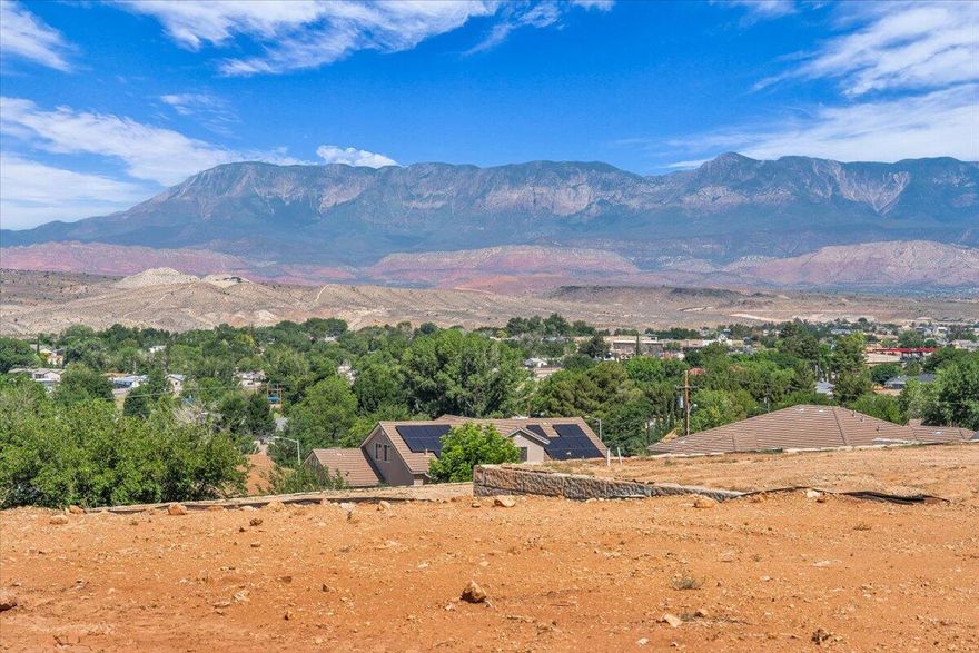 This 0.24-acre lot is part of four contiguous parcels, offering endless potential. It's the perfect place to build your dream home, surrounded by peaceful desert landscapes and breathtaking views. You also have the option to add an income-producing accessory dwelling unit (ADU) for extra space or rental potential. For builders and developers, this property presents a strong investment opportunity with multiple development possibilities. With no HOA and the flexibility to bring your own builder, you'll enjoy maximum control over your project. Located close to Zion National Park, Sand Hollow, Warner Valley, sand dunes, and world-class outdoor recreation, this is a prime location to create something truly special. Buyer/buyer agent is responsible for verifying all information.