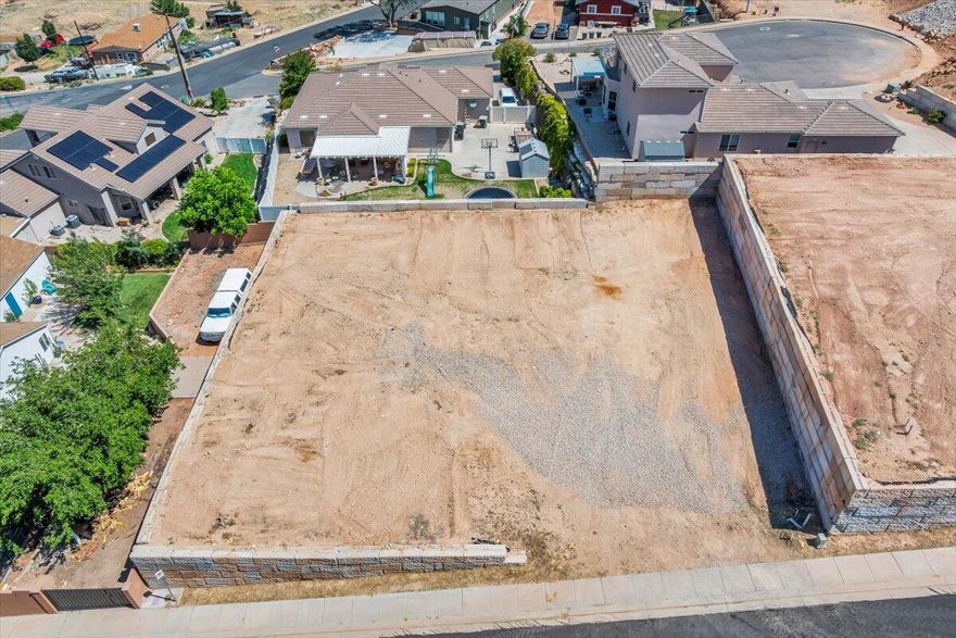 This 0.24-acre lot is part of four contiguous parcels, offering endless potential. It's the perfect place to build your dream home, surrounded by peaceful desert landscapes and breathtaking views. You also have the option to add an income-producing accessory dwelling unit (ADU) for extra space or rental potential. For builders and developers, this property presents a strong investment opportunity with multiple development possibilities. With no HOA and the flexibility to bring your own builder, you'll enjoy maximum control over your project. Located close to Zion National Park, Sand Hollow, Warner Valley, sand dunes, and world-class outdoor recreation, this is a prime location to create something truly special. Buyer/buyer agent is responsible for verifying all information.