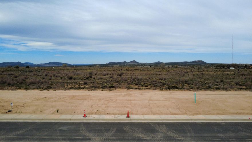 Ready-to-build .14-acre lot in a growing community of single-family homes! This property offers the perfect opportunity to bring your vision to life in a desirable and expanding area. Enjoy being just minutes from Three Peaks, known for its incredible recreational opportunities including hiking, biking, and off-road trails. Take in the stunning views of Cedar Mountain and unwind under beautiful, wide-open night skies. A great location for those seeking both outdoor adventure and peaceful surroundings while still being close to town. Ask us about bulk pricing opportunities when purchasing 10+ lots!