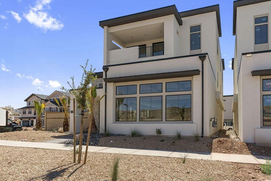 Experience luxury living in the heart of Desert Color Resort with this stunning, newly completed Holmes Homes-built residence. This 3-story luxury home offers 7 beds, 7 full baths, & 3 half baths, thoughtfully designed for both high-end nightly rental income and unforgettable personal enjoyment. Spanning three levels, the home features expansive gathering spaces, multiple balconies, a large designer kitchen and dining area, and high-end finishes throughout. Enjoy your own private pool & hot tub perfect for entertaining guests of all ages. The home can be purchased fully furnished, making it truly turnkey. Located just a short walk to the new resort pool and hot tubs, owners also enjoy access to Desert Color's 2.5-acre lagoon, heated pools, pickleball courts, snack shack, and more.