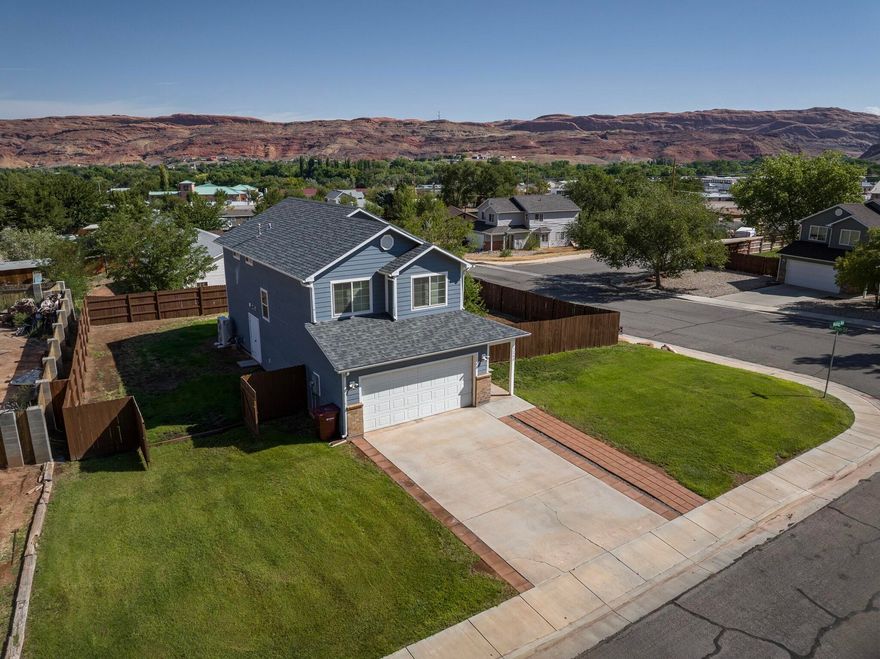 Seller is not offended by low offers. All offers will be considered and countered. Welcome to Madison Way, a spacious 4-bedroom, 2.5-bathroom home located just outside Moab city limits. Situated on a .21-acre lot, In 2024 this property was upgraded, including a completely new roof, upgraded siding, water heater, and high efficiency central heating and air conditioning. It lies just outside the Moab city limits and as such benefits by having lower taxes while remaining close to all that Moab has to offer.  Inside, you'll find a thoughtfully designed layout with ample living space for comfort and functionality. The bedrooms are well-proportioned, and the primary suite includes its own bathroom for convenience. The additional bathrooms serve both family and guests with ease.  The outdoor space provides room to enjoy Moab's natural beauty, whether for gardening, entertaining, or simply relaxing. With its location just beyond city limits, this home combines the appeal of a private setting with the accessibility of nearby amenities.  This property presents an excellent opportunity to enjoy life in Moab with both space and convenience.