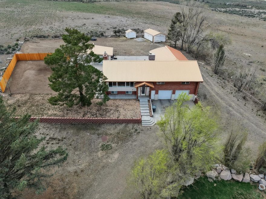 Just under 1 acre with beautiful 2784 square foot home in Panguitch, UT. Landscaped with evergreen and deciduous trees, lots of parking and out buildings. Wood floors throughout main level, tile in basement. Oversize garage, private well, new appliances. Call for a private tour.
