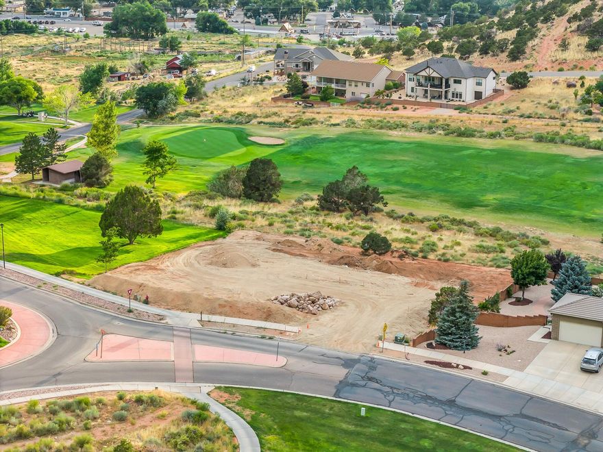 Looking for one of the best views IN town and OF town? This large .60 acre lot has views of the city lights all the way across town in one direction and the gorgeous red rock canyons in the other! One of the largest remaining building lots in an exclusive golf community, this lot sits along the fairway and has being graded for a walkout basement, so you'll have views on two levels. All utilities are to the lot or in the street, and you can bring your own builder. Lot will require water acquisition fee and water meter.