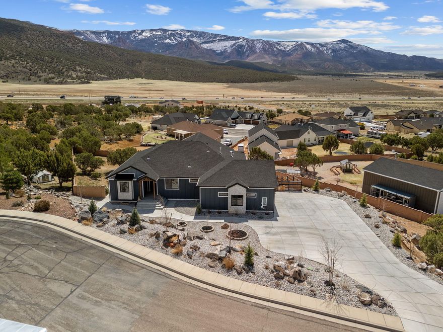 Short sale, subject to 3rd party approval. Nestled in the desirable Eagle Ridge at South Mountain, this stunning custom home offers breathtaking views of the pink cliffs of Shurtz Canyon. Built in 2022 on a spacious .84-acre lot, it features a walk-out basement with a large patio, two decks—including a private one off the master bedroom—and ample outdoor space to take in the scenic surroundings.

Inside, the home boasts a spacious kitchen and living room with vaulted ceilings, creating an open and inviting atmosphere. A wall of windows floods the space with natural light and showcases the stunning views—perfect for entertaining.

The property is mostly fenced, with completed front yard landscaping and a partially finished backyard, allowing the new owner to add their own personal touch. 

The basement space is currently rented but could easily be used as a second master suite or a private mother-in-law quarters. With mature trees, a dedicated dog run, and an oversized walk-in pantry, this home has it alloffering the benefits of new construction without the wait!