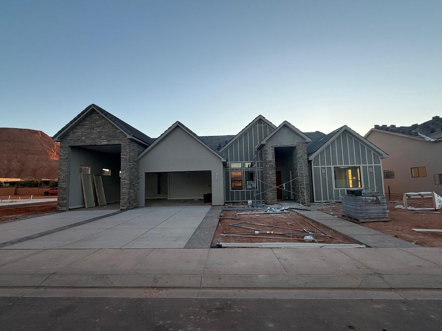 Finally...the home that has it all! Large lot, giant slider in the great room, butler's pantry, casita, a view of the Red Mountain, 20x40 pool, epoxy garage floor, wired for surround in the great room, and a 36 ft deep RV garage with a 12x14 door!! There is also room for RV parking on the side.  In addition to the casita, this home also has a guest suite.  The floor plan is open and light.  The finishes are high-quality and beautiful: stunning iron door, combo of painted and knotty alder cabinets, gorgeous quartz countertops, elegant tile fireplace, GE CAFE appliances and hardwood floors in the Entry, Hall, Great Room, Kitchen, Dining Room, Pantry, Mudroom Den & Casita.