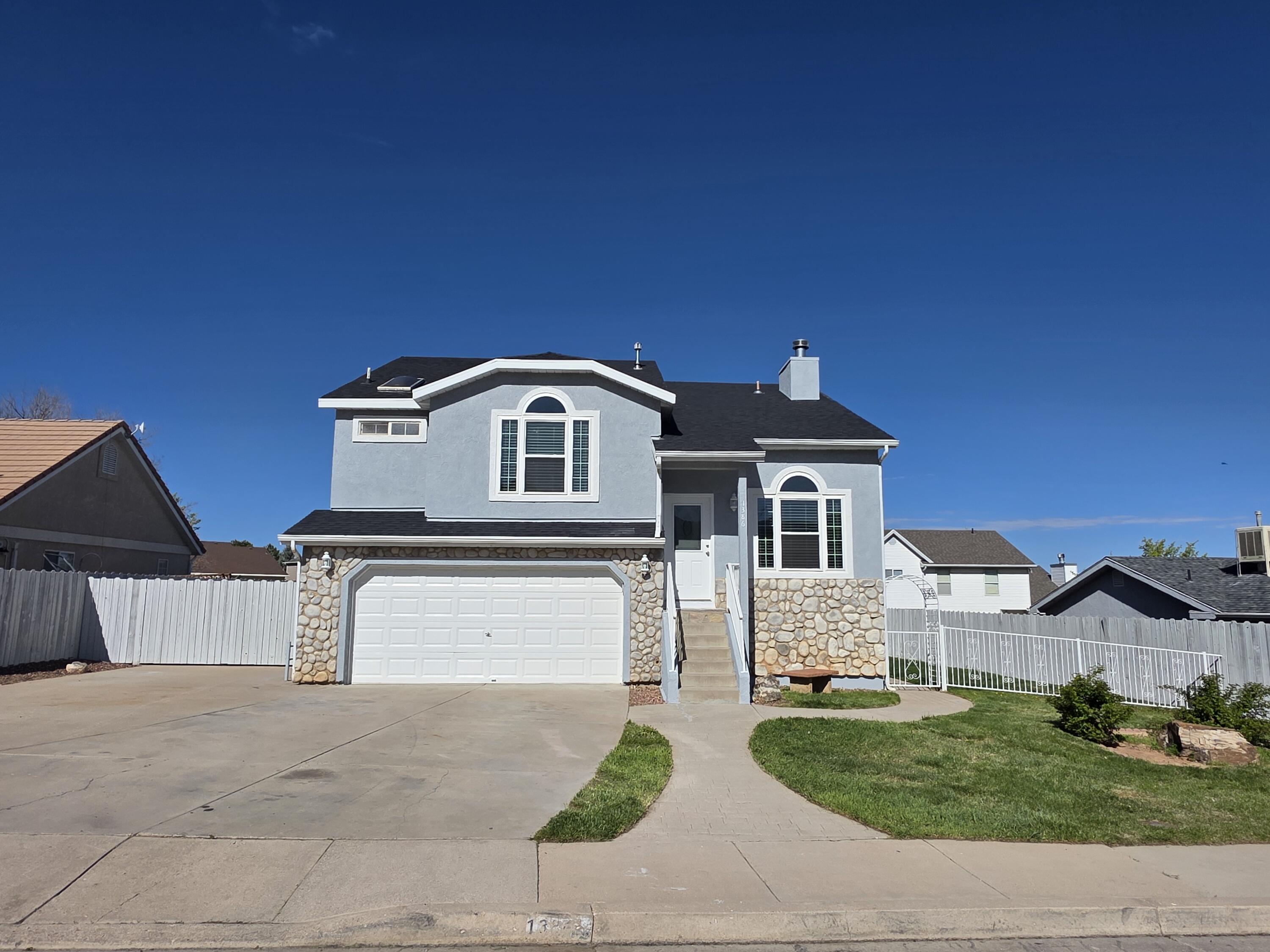 Welcome to this beautifully updated 4-bedroom, 3-bathroom home, perfectly situated near the mountains and offering both comfort and convenience. Set on a generous 0.17-acre fully fenced lot, this property features a large parking pad and extended driveway—ideal for multiple vehicles or recreational toys.

Inside, enjoy the fresh look of new flooring and updated interior and exterior paint. Vaulted ceilings enhance the sense of space, filling the home with natural light and creating an airy, open feel. With a smart layout and ample living space, this home is perfect for families, guests, or a home office setup.

Whether you're relaxing indoors or entertaining in the expansive backyard, this home checks all the boxes. Move-in ready and minutes from outdoor adventure, shopping, and schoolsdon't miss your chance to make it yours!
