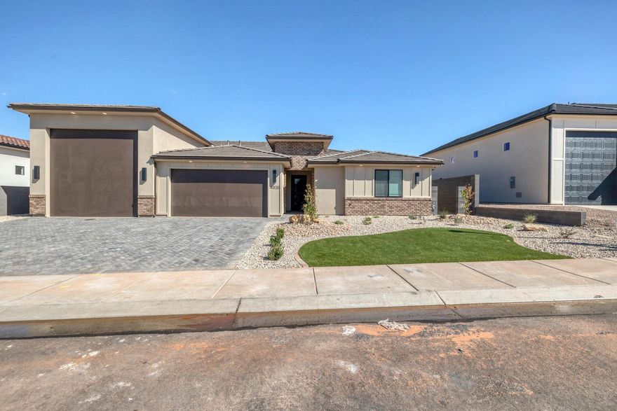 Beautiful 4-Bedroom Home with Attached Casita, RV Garage & Designer Touches! Welcome to this stunning 4-bedroom, 3.5-bathroom home offering a flexible floor plan and luxury finishes throughout. One of the bedrooms is a private attached casita ideal for multi-generational living, guests, or a second primary suite. Inside, you'll find an inviting living area featuring a cozy fireplace bookended by custom built-in shelving—perfect for entertaining or relaxing. The spacious kitchen and open-concept layout provide an easy flow for everyday living. For car and adventure enthusiasts, this home boasts a 17' x 45' RV garage in addition to a 2-car garage, offering ample parking for at least 4 vehicles and plenty of room for toys, storage, or a workshop.