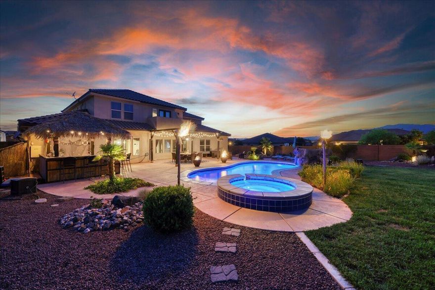 No Showings on this property at this time!  Lease Option available. Welcome to the enchanting oasis of Little Valley! This corner lot home offers an ideal blend of desert landscaping in the front and a gorgeous backyard, perfect for entertaining and relaxation. With 7 generous bedrooms, one can be a theater room, family room, den/office, large 3-car garage with RV parking, pool, hot tub, gas tiki torches, 3 fire pits, and a fully-equipped outdoor kitchen, this property is a dream come true for those seeking both space and relaxation. Don't miss the chance to make this captivating residence your own - schedule a tour today! Outdoor furniture is included.