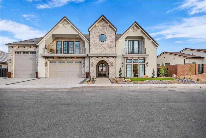 A custom home that blends classic architecture with cutting-edge technology and contemporary comfort. Every inch of this residence was crafted for livability, beauty, and indulgence. A grand arched entrance, light-filled living spaces with soaring ceilings, stone accents, and seamless indoor-outdoor flow. The chef's kitchen features professional-grade appliances, a walk-through scullery pantry, and elegant finishes designed for both everyday use and entertaining. A discreet passage leads to the primary suite-a true sanctuary with a freestanding soaking tub, expansive walk-in shower, custom closet system, and private in-suite laundry. The main level also includes a private Casita with its own kitchen, bath, and laundry, ideal for guests or multi-generational living. Furniture Included. Upstairs offers a family lounge, children's play/art area, and three bedrooms with en-suite baths and walk-in closets, each opening to private balconies and sun-filled decks. Resort-style outdoor living surrounds a self-cleaning pool, spa, fire features, and a fully equipped outdoor kitchen. Beneath the upper sun deck lies a recreation lounge with kitchenette, perfect for gatherings or relaxing by the pool. The accessory building conceals a one-of-a-kind hidden surprise never before seen in a residence, must see in person for the reveal! It is Crowned by a rooftop deck and a custom slide descending to the pool below. A private gym sits behind the oversized three-car garage with RV/boat bay. This is a fully integrated smart home, giving you complete control from your own app. In the event of a power outage, the system automatically transfers to a backup generator, ensuring uninterrupted comfort and security. This home that redefines luxury, blending timeless design, indulgent details, and advanced technology invites you to experience refined living at its finest.