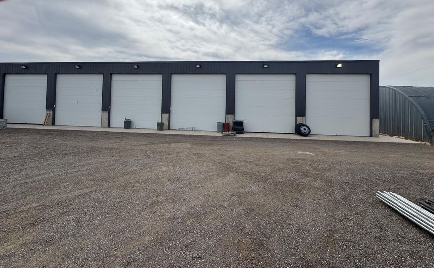 The perfect Industrial location for shop work or space on Horse Alley. 3 buildings 1, 24x 22 sq ft 2, 18x20 and building 3 is 16 x 40 8 units with 14' doors. Building consisting of a total of 5120 sq ft and divided into 40 deep by 16 Equal units that can be rented as storage units or work spaces. Two Connex boxes onsite are also included. Lots of yard space left for whatever needs you may have.