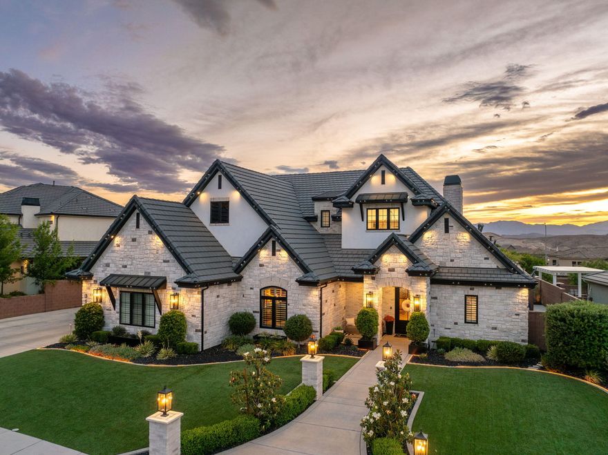 This is not a home, it's an experience. This fully customized Little Valley estate delivers over $800K in upgrades and a rarely seen level of detail. From the moment you walk in, the scale, design, and finishes set the tone. Soaring ceilings, statement fixtures, and perfectly curated ambient lighting are all controlled by a full Control4 smart home system. The kitchen is built for gathering, featuring an oversized island, butler's pantry, high-end appliances, custom cabinetry, and seamless flow into expansive living spaces. The primary suite features vaulted ceilings with exposed black beams creating a striking contrast with the recessed lighting and a chandelier. The spa-inspired bathroom showcases a double vanity with pendant lighting, a freestanding bathtub, and glass doors isolating the large walk-in shower. The spacious walk-in closet offers an organized layout with a central island, multiple drawers, and double-tier hanging rods.  On the main level you can focus on the designated office or work out in the fully equipped home gym with perfect lighting. Upstairs, the fully immersed movie theatre creates a true cinematic experience, including an additional living room and hang out den. Step outside and everything changes. The backyard is a private resort complete with a custom pool, hot tub, waterfall, and rockslide. The outdoor living space built with a modern design, stone pillars, built in counters and accent lighting is next level. It features a fully built-out kitchen with a pizza oven, BBQ, fireplace, integrated heaters, and a TV. Designed for year-round use, put the shades down, turn the fireplace on and enjoy a cozy winter evening. The private sports court is accompanied by high-end artificial turf. Whole-home audio with surround sound carries throughout the interior and exterior of the property, creating a seamless indoor-outdoor experience. No HOA. No compromises. No comparison. This is one of those properties that simply doesn't come around often