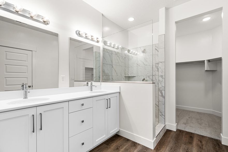 4 bed with Primary on the main level, 2.5 bath home with a 2-car garage in the brand-new Desert Reflection community by Salisbury Homes. Features include EVP flooring in main living areas and bathrooms, upgraded carpet in bedrooms, quartz countertops throughout, stainless steel gas appliances (fridge not included), modern cabinets, and kitchen backsplash. Community park, trails, and amenities nearby. NOTE: Interior and exterior finishes are predetermined and may change. Photos are examples of the finishes are also subject to change. TAKE ADVANTAGE OF A $10,000 LENDER INCENTIVE AND GET A LOWER RATE! Buyer/agent to verify all info.