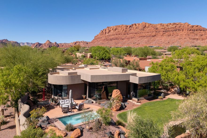 Immaculate 3 bedroom home in the prestigious Kachina Springs at Entrada Country Club. Open floor plan features living room, dining area, main bedroom and kitchen facing an outdoor view of the mountains and red rocks - wood flooring throughout. Gourmet Kitchen includes Wolf stove with a grill and oven, a wolf drawer microwave; Sub-zero refrigerator and beverage cooler including a full-sized freezer; new Bosch dishwasher; instant hot water and reverse osmosis faucets in kitchen; tons of cabinet space and a large kitchen island and oversized hidden pantry. Spacious Patios: Lounge in the morning sun on a large back patio with Sunbrella lawn furniture, gaze at a stream with waterfalls and a small bridge. Enjoy the spa pool, fire pit, and gas grill. Watch the sunsets from the front patio with its 2nd fire pit. In the casita, find a queen-sized Wilding Wallbed book-case/Murphy bed; a microwave, fridge and sink. There is a built in desk for two in the 2nd guest rm. Also find display niches; a jetted tub; pass-through feature to the laundry through the main BR closet; a LARGE 3 car garage with 11 built-in cabinets, a workbench and epoxy floor. 2 Carrier air conditioners and 2 ICP heaters. Associate membership to Entrada Country Club required. Ask agent for details.