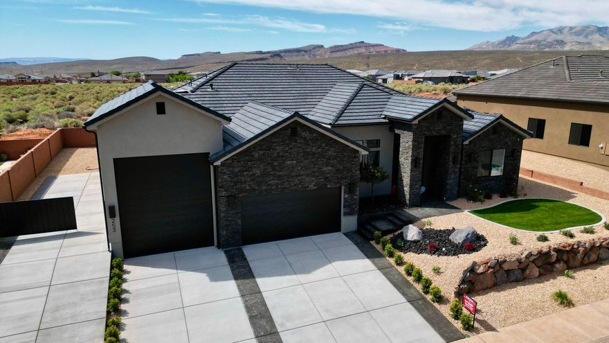 Unity Village is a serene neighborhood in the heart of Ivins. Enter this home through a magnificent iron door.  Tuck your guests away in the attached casita with a separate entrance, full bathroom, walk-in closet, and stunning view of the Red Mountain. There is also a guest suite with an attached bathroom, closet, and sliding glass door to the back patio. Store your boat or sprinter van in the 29 ft deep RV garage. Calacatta Venice quartz countertops, a warm knotty alder island, painted perimeter cabinets, and GE CAFE appliances enhance the kitchen. The spacious, elegant owner's suite adds the ''wow factor'' you've been looking for...AND there is So much to do: Close to trails, Tuacahn Amphitheatre, Snow Canyon, Gunlock Reservoir, and Kayenta Art Village.