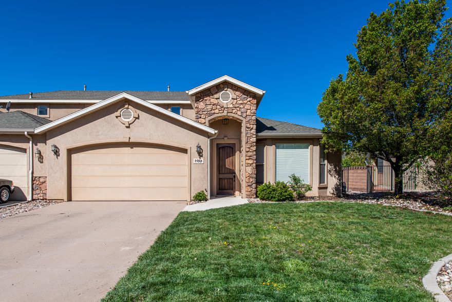 Beautifully maintained Cedar City twin home in Cedar Mountain Villas offering 3 bedrooms, 2.5 bathrooms, and a functional two-level layout with the primary suite on the main floor. This move-in-ready home features an open-concept kitchen with rich, solid wood cabinetry, extra bar seating, matching stainless steel appliances, generous prep space, and easy flow into the dining and living areas.  Enjoy the colder evenings with the cozy fireplace. The spacious primary suite includes a relaxing jetted tub, a separate shower, and a walk-in closet. Upstairs, large bedrooms provide flexibility for guests, family, or office space, and have wood built-in organizers. Brand new water heater and front porch light fixture.  Enjoy the covered patio, complete with new concrete and nice sunshades. The backyard is landscaped with brand new beautiful xeriscaping. The attached 2-car garage stands out with a unique upgraded auto shop-quality garage floor (Swiss Trax) offering a clean, polished, and highly functional space unlike any other garage in town. Conveniently located near trailheads, parks, schools, shopping, and everyday amenities, this property combines comfort, practicality, and easy living in Cedar City. The owner currently has a month-to-month leased tenant who would like to remain if possible, but undertands its based on the new owner's preference. Ideal for an investor OR a new home owner who wouldn't have to wait out a lengthy lease on an occupying tenant. In summary, this home offers 3 bedrooms, 2.5 baths, 1,848 sq ft, a 0.14-acre lot, an attached 2-car garage, and was built in 2006. Most furniture and some decor included!