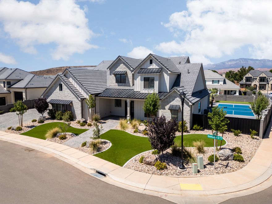 Remarkable & timeless home in the desirable Queensridge neighborhood. Expansive yard on just under 1/2 acre with pickleball & basketball court, saltwater pool with spa & motorized cover, mature palm trees & big turf area. Rare 2046 sq ft garage, with a 14' tall RV door & 50' deep. Chef's kitchen with professional grade Monogram appliance package, dual dishwashers, butler's pantry & 12' sliding glass door in the great room creating fantastic indoor-outdoor living. 10' ceilings on both floors, complete with an office & second bedroom on the main floor. Primary bedroom features a 12' sliding glass door, a spa-like bathroom & custom closet system. Large living room upstairs + a dedicated laundry room. Excellent upgrades throughout including, motorized blinds, plantation shutters & ample storage. Owner Agent.