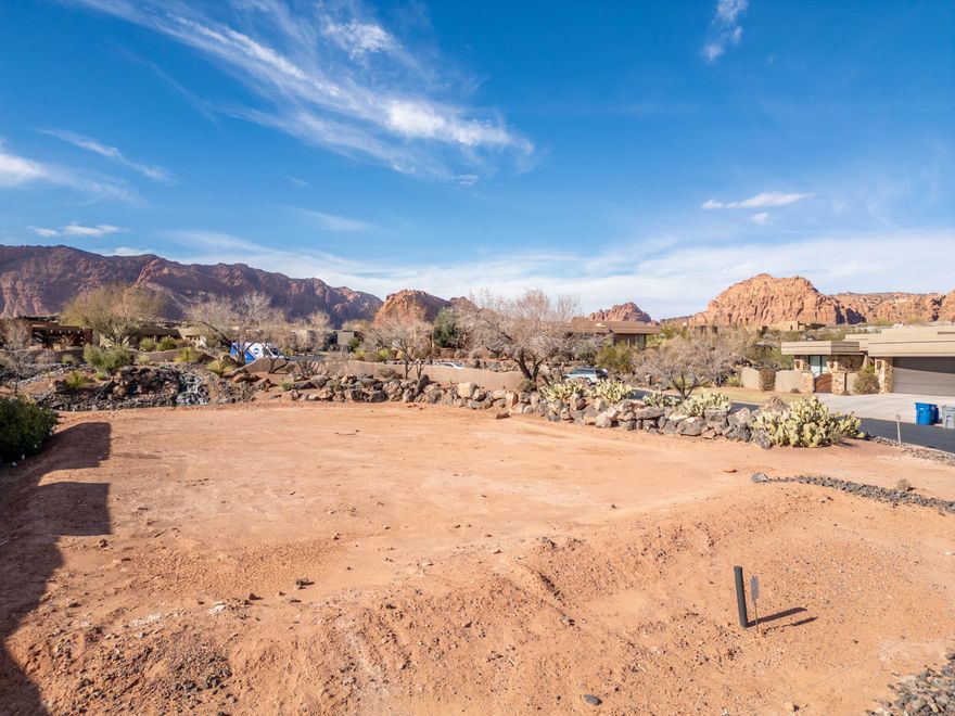 Corner building lot within one of the most distinctive and desirable communities in southern Utah, the reserves of Entrada.  Post card views.  Pad ready with a beautifully landscaped waterfall to the rear of the property.  Private, gated.  Surrounding homes with some of the most spectacular architecture in the area.  Must join the Entrada Country Club as an associate member.