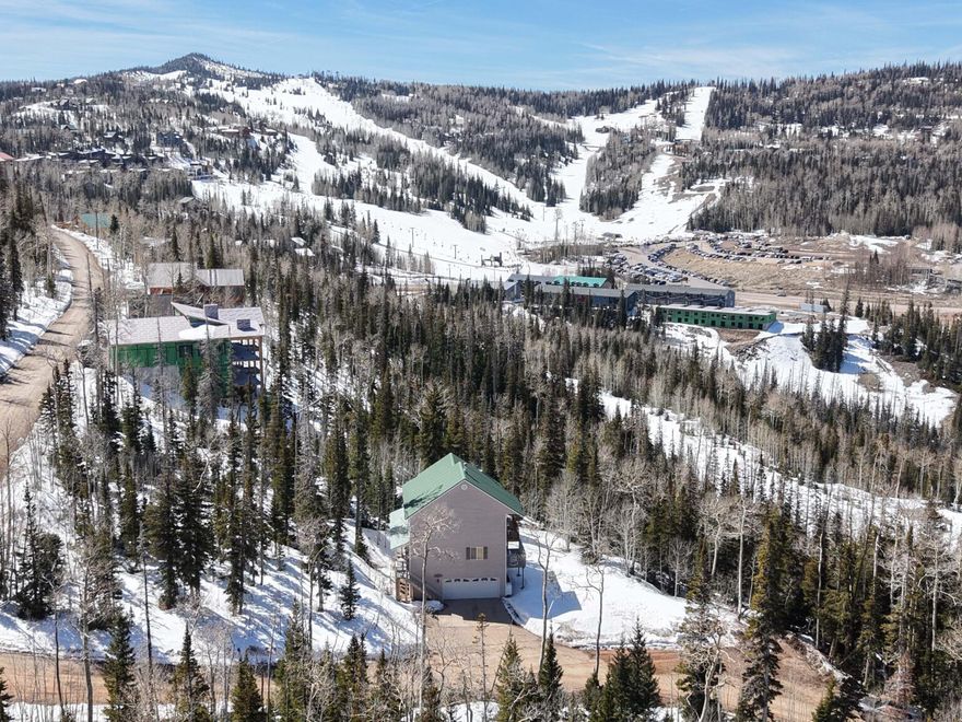 2503 SF on wooded .46 acre with paved year-round access. Full furnished with Ca-King Sleep Number, walk-in shower and large soaking tub in master which also has a deck off the room with fabulous view. Double bunks in upstairs room, queen bedroom with walk-in close on main level. Basement heated storage area. Oversize garage.Located 1 minute from ski resort. Year-round accessible and STR approved.