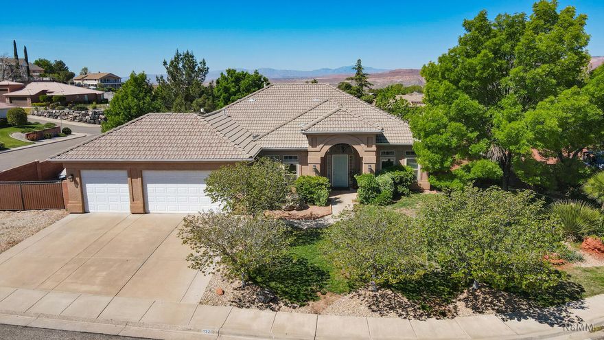 This 3 bedroom, 2 bath home in Hurricane sits on a spacious lot with mature trees that provide plenty of shade. The spacious primary bedroom has a lot of natural light, along with a roomy primary bath. The family room includes a fireplace, great for the cooler months.  The fully fenced backyard provides privacy and mountain views, creating a quiet place to relax outdoors. Additional features include fresh interior paint, newer carpet, and new windows installed in 2021. The property also offers RV parking, a storage shed, and a 3-car garage.