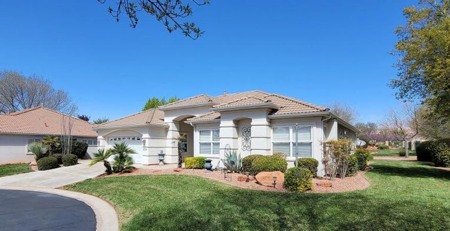 Welcome to your dream home on a quiet Cul-de-sac! Nestled in a serene gated community, this beautiful single-family rambler offers stunning views of Pine Valley Mountain, complete with picturesque streams and a soothing waterfall.  newer carpeting in bedrooms, water softener & extra wide garage. Enjoy year-round comfort with a new AC and furnace unit. Conveniently located near shopping, dining, and recreational opportunities, this home offers the perfect balance of tranquility and 
accessibility. Part of the Green Springs HOA with indoor/outdoor pools, tennis & pickleball courts/exercise room/clubhouse/cable TV & Gated, Full Yard Care, Cable Etc. *** All furniture is available for purchase should the buyer want any of it. On quite cul-de-sac. HOA - year round Pools, Hot Tub, Gated, Full Yard Care, Cable Etc.